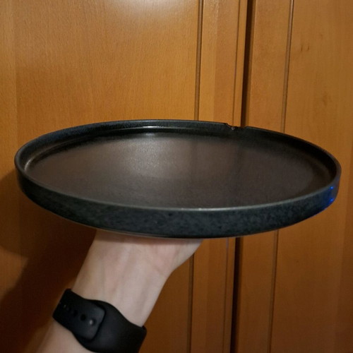 Porcelain plate used, black with small chip