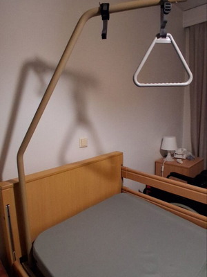Electric hospital bed like new with mattress, wheels, and patient lifter