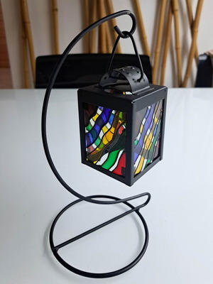Aluminum decorative candlestick like new with unique stained glass detail and black hanging base