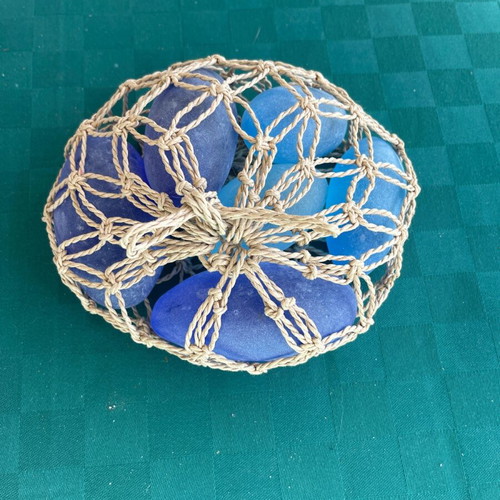 Doorstop made of pebbles like new, blue and light blue