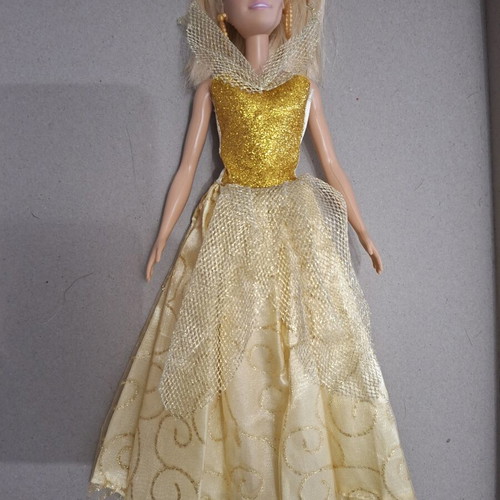 Barbie doll like new with golden dress