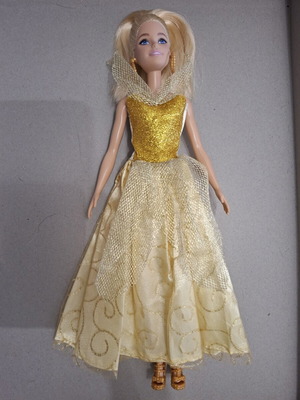 Barbie doll like new with golden dress
