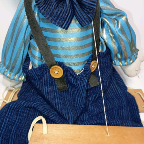 Marionette clown used with wooden control bar
