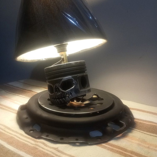 Handmade desk lamp with piston and clutch plate in deep black mat