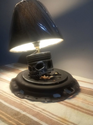 Handmade desk lamp with piston and clutch plate in deep black mat