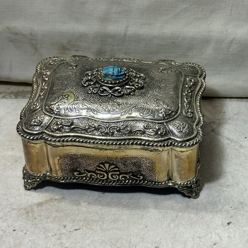Vintage metal jewelry box with blue scarab, used