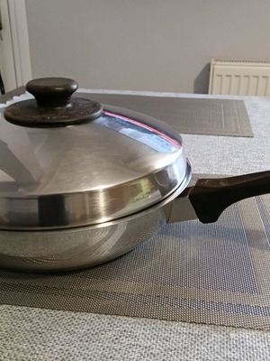 Fissler stainless steel frying pan used with lid and frying basket