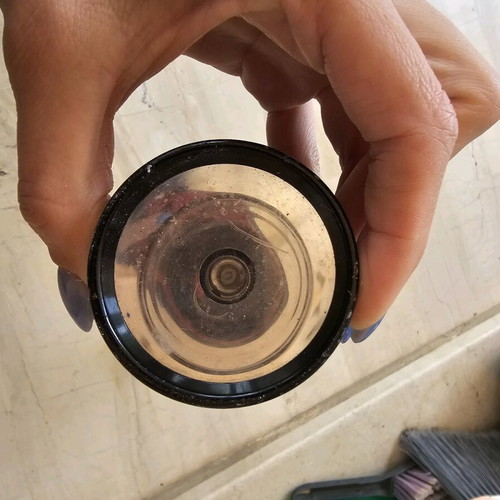 Flashlight used with swollen battery