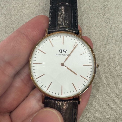 Daniel Wellington watch 40mm used with black handmade leather strap