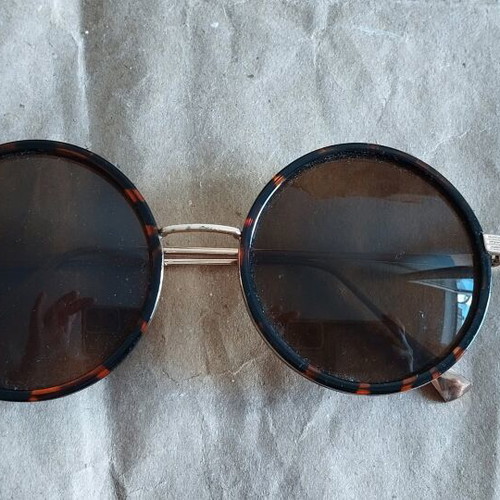 Faux sunglasses used, round with soft leopard pattern