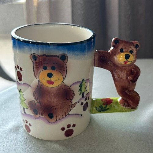 Vintage children's ceramic mug used with embossed designs