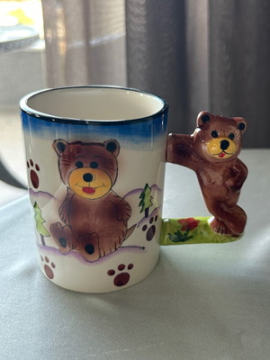 Vintage children's ceramic mug used with embossed designs