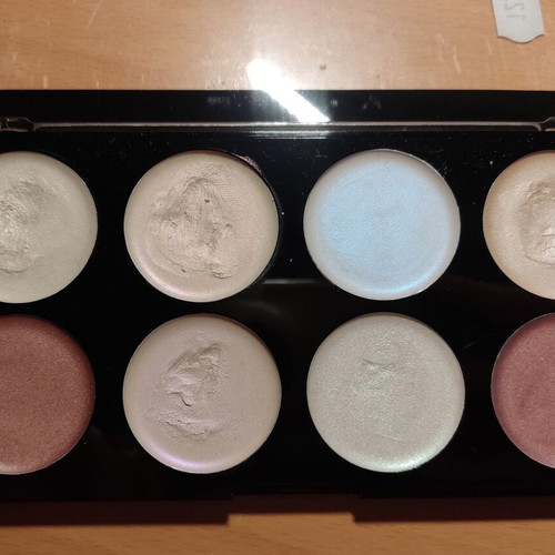 Makeup Revolution highlighter palette used, creamy formula