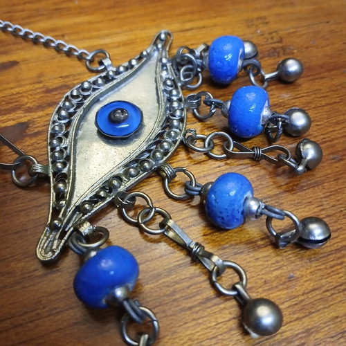 Vintage metal evil eye decoration used, silver with blue beads