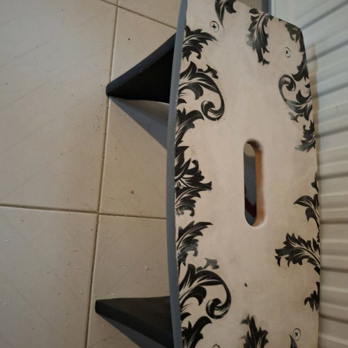Footstool used with black and white decoupage technique