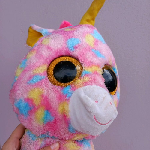 Plush unicorn used, very large, colorful with glass eyes