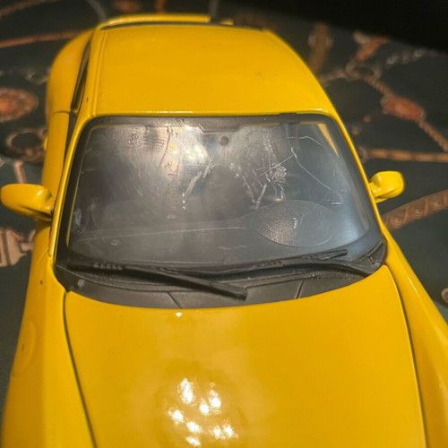 Porsche Carrera yellow 1:18 like new with hazy front windshield
