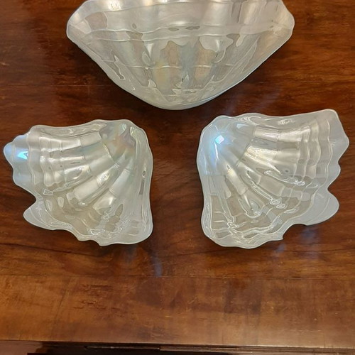Three platters in the shape of a conch