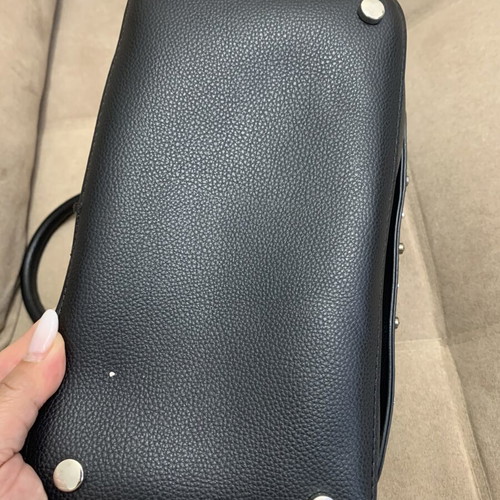Black handbag with studs used, includes detachable pouch
