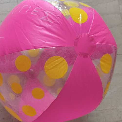 Inflatable beach ball used, pink with yellow dots, 40 cm diameter