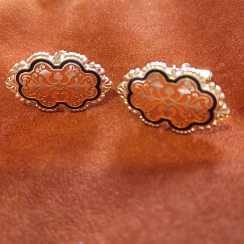 Orofix cufflinks used, vintage, embossed gold on coral background