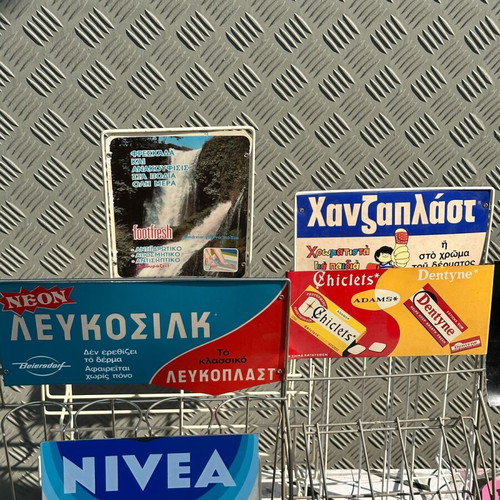 Retro kiosk stand used with authentic vintage advertisements