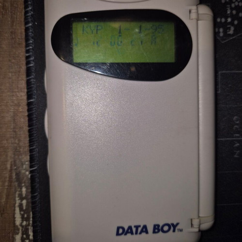 Data Boy handheld console used, powers on normally
