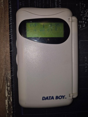 Data Boy handheld console used, powers on normally