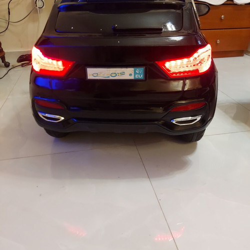 BMW X6 electric ride-on car like new with remote control and LED lights