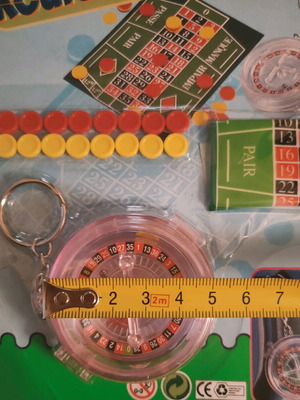 Mini roulette keychain new, sealed package
