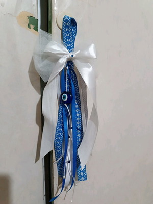 Handmade new lucky charm for the new year in Greek flag colors