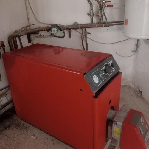 Complete oil heating system used with boiler burner and tank