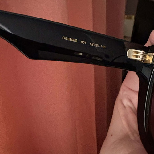Gucci sunglasses new, black with mauve suede case