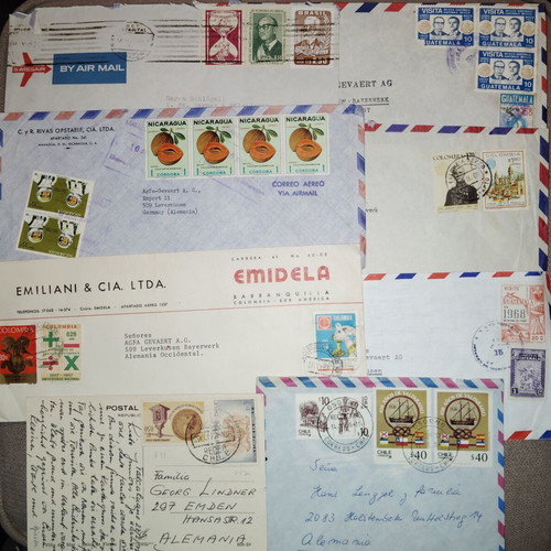 Collection of envelopes and stamps from around the world, new