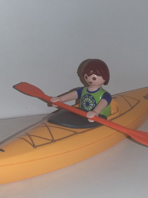 Playmobil boatman figure with paddle and boat like new