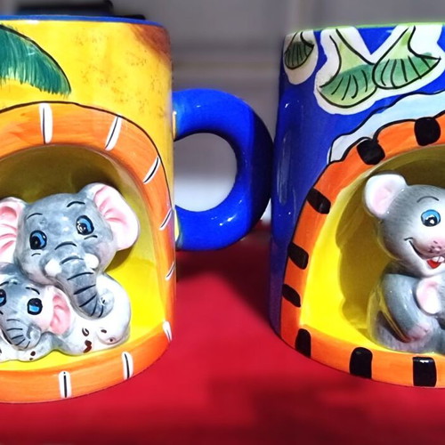 Decorative ceramic mugs set of 2 with embossed animal designs like new