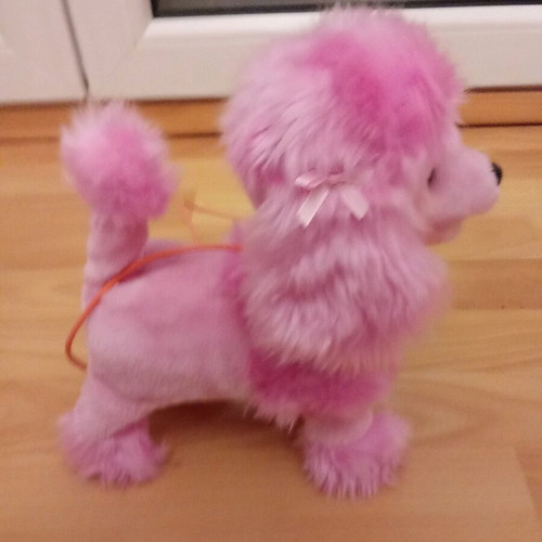 Toy dog with remote control like new that barks and moves