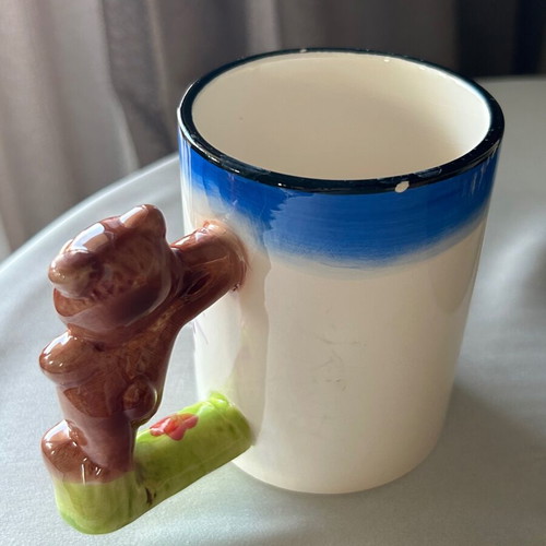 Vintage children's ceramic mug used with embossed designs