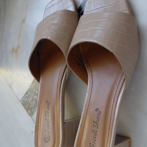 Beige women's mule shoes with low block heel