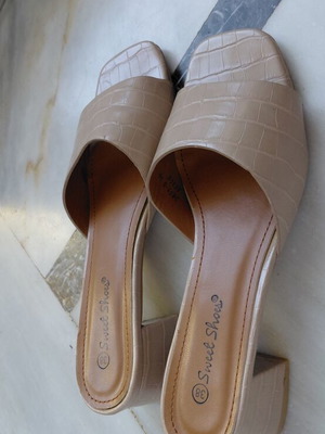 Beige women's mule shoes with low block heel
