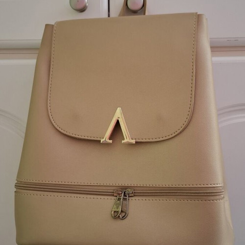 Backpack bag gold color like new