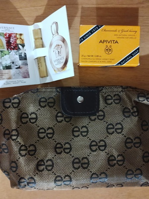 Mini toiletry set with brown-gold cosmetic bag, Apivita soap, Versace Eros Pour Femme sample