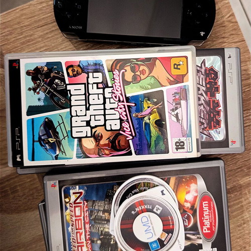 Sony PlayStation Portable (PSP) used with top game bundle and charger, needs repair