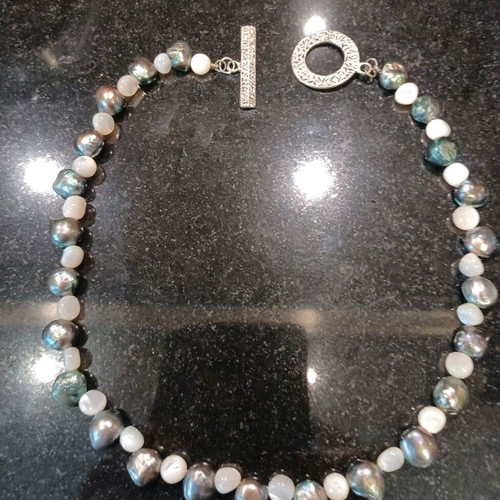 Necklace with white and olive stones, carved clasp, like new