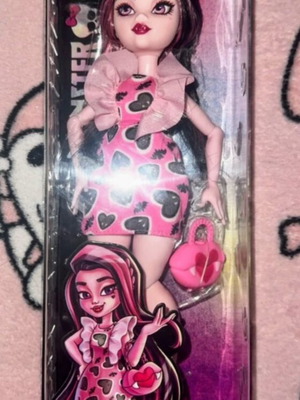Monster High Draculaura doll with pink mini dress and accessories