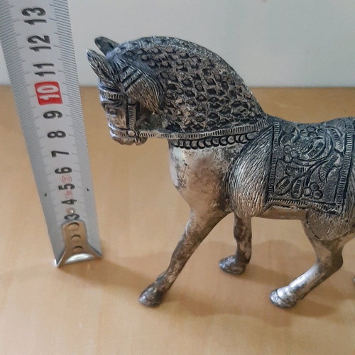Vintage metal horse used with carved details