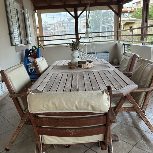 Outdoor wooden dining set used with 6 chairs and cushions