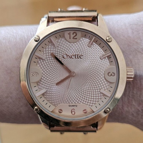 Oxette quartz watch used with bracelet and pink gold ring