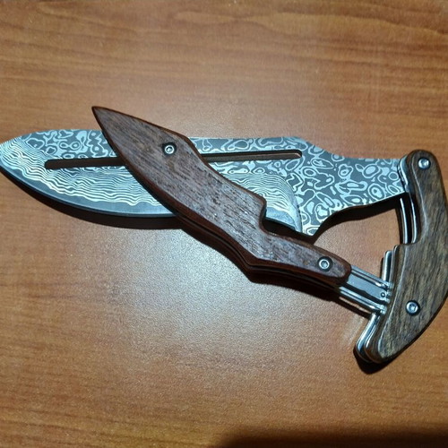 Folding knife with opening mechanism and Laser Pattern Damascus blade, like new