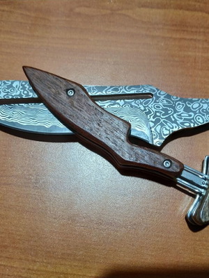 Folding knife with opening mechanism and Laser Pattern Damascus blade, like new